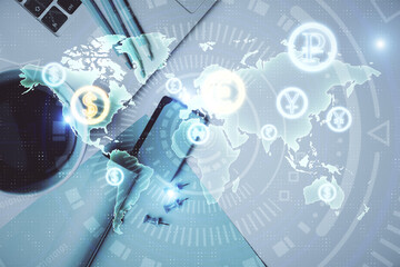 Double exposure of forex graph drawing over desktop background with computer. Concept of financial...