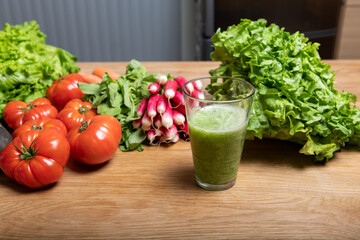 Vegan woman making vegetable juice for detox