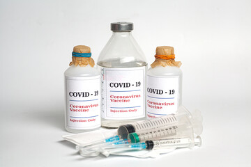 Coronavirus Vaccine injection vials medicine drug bottles Covid-19 with syringe