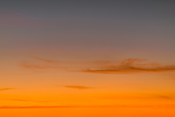 Orange horizon and blue atmosphere. Smooth orange blue gradient of dawn sky.
