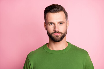 Fototapeta premium Photo portrait of man wearing green pullover serious face isolated pastel pink color background