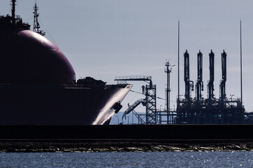 LNG TANKER AND TERMINAL - The ship is maneuvering in gas port