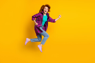 Fototapeta na wymiar Full body portrait of crazy energetic lady jump open mouth hurry wear magenta plaid isolated on yellow color background