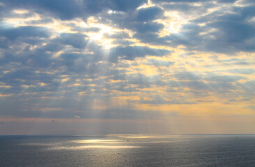 Beautiful colourful sunset with clouds at Uluwatu Temple, Pura Luhur Uluwatu, Bali, Indonesia