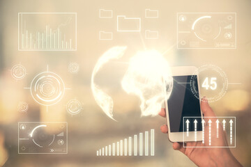 Double exposure of forex chart sketch hologram and woman holding and using a mobile device. Stock market concept.