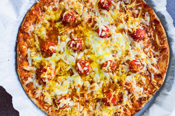 plant-based food, vegan flatbread pizza with cherry tomatoes and dairy-free cheese