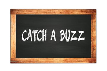 Obraz premium CATCH A BUZZ text written on wooden frame school blackboard.