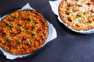 plant-based food, vegan flatbread pizza with cherry tomatoes and dairy-free cheese