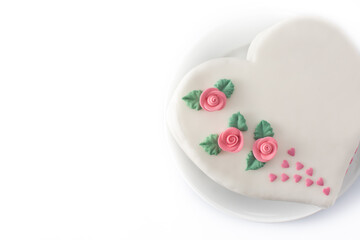 Heart cake for St. Valentine's Day, Mother's Day, or Birthday, decorated with roses and pink sugar hearts