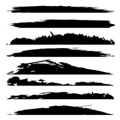 Fototapeta premium Vector collection of artistic grungy black paint hand made creative brush stroke set isolated on white background. A group of abstract grunge sketches for design education or graphic art decoration