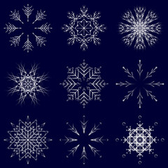 Naklejka na ściany i meble Vector collection of artistic icy abstract crystal snow flakes isolated on background as winter december decoration group or collection. Ice or frost beautiful star ornament silhouette or season art
