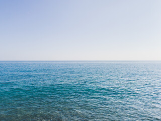 Blue sea and clear blue sky background