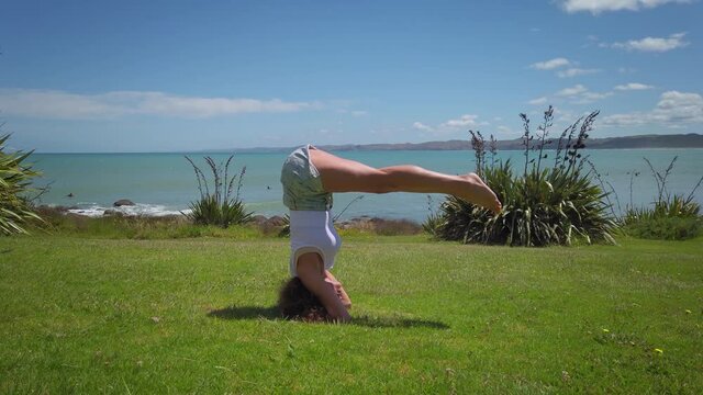 Doing Yoga by the beach