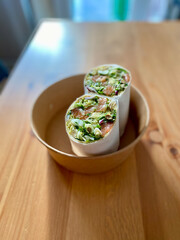Take Away Salmon Wrap with Avocado Mash and Roti Dough. Take Out Seafood.