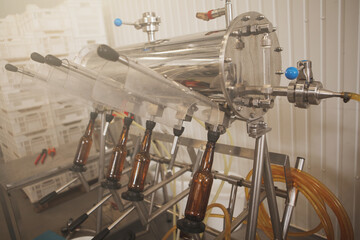 Bottles in bottling apparatus at beer factory