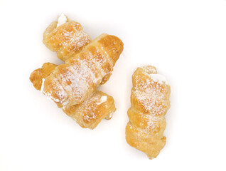 cream horn or schamroll traditional sweet europe cake with white background