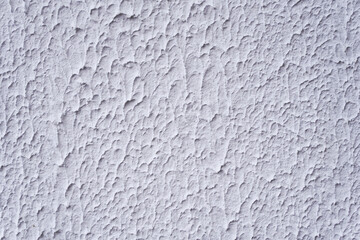 Structure of textured white decorative plaster as background.