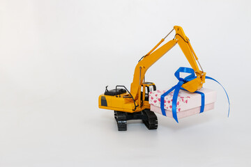  Excavator model with lift up gift box,  Holiday celebration concept new year on white background