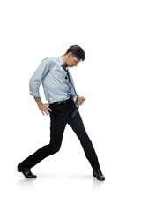 Celebrity. Happy young man dancing in casual clothes or suit, remaking legendary moves and dances of celebrity from culture history. Isolated on white. Action, motion, fame concept. Creative