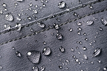 waterproof fabric - closeup of water resistant textile with water drops