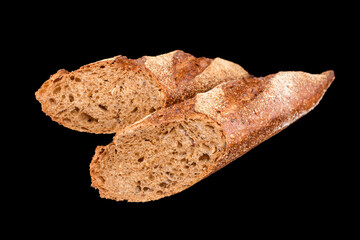 Freshly baked homemade bread isolated on black. French bread baguette. Healthy eating and traditional bakery, baking bread concept
