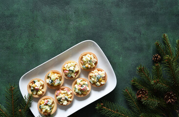 Tartlets with salad on the New Year's table.with salad with crab sticks