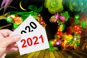Hand holding cards with figures 2021 New Year over 2020. Two thousand twenty one is coming. Two...
