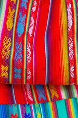 Colorful market with beautiful and unuque handicraft fabric patterns available in Otavalo, Ecuador
