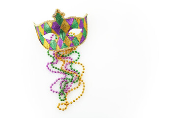 Fototapeta Mardi gras mask and colorful beads on white background obraz