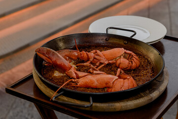 rice with lobster seafood paella. food and drink concept
