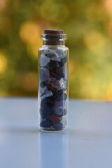 minerals in a glass bottle

