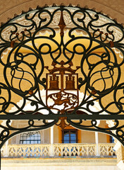 Artistic iron fence in the courtyard of the Casa de Pilatos, one of the most important palaces in Seville. Andalusia, Spain