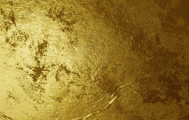 Grunge gold foil texture background with cracks and scratches