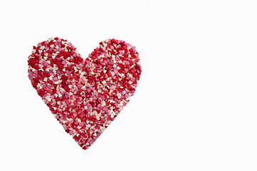 close up confetti in the shape of hearts on a pink background copy space. happy valentine's day concept