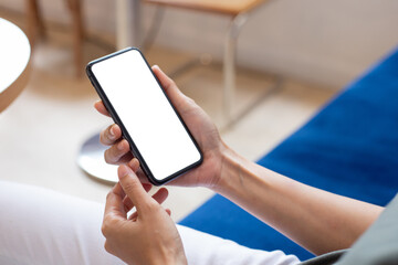 cell phone blank white screen mockup.woman hand holding texting using mobile on desk at office.background empty space for advertise.work people contact marketing business,technology