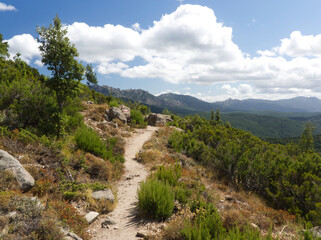 Fototapeta na wymiar Following the track when hiking around the aiguilles de Bavella