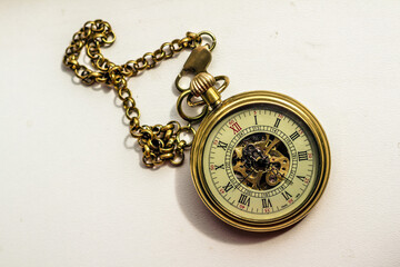 isolated golden pocket watch