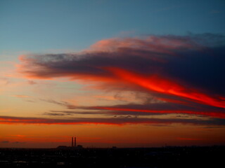 Colorful clouds over coal-burning power plant