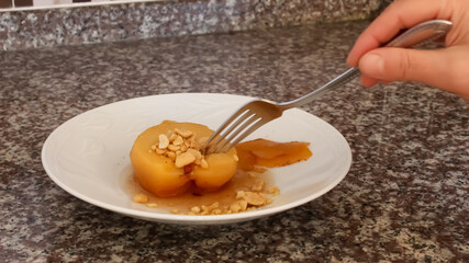 Traditional Turkish dessert. Quince dessert and peanut.