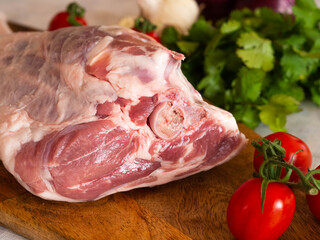Fresh and raw meat. Leg of lamb on wood background