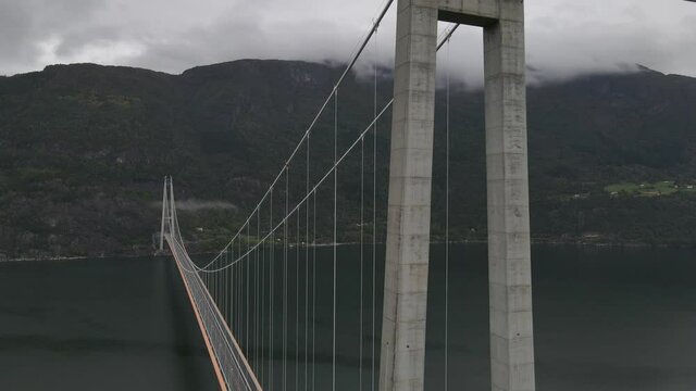 Upgoing areal footage of one of the longest suspension bridges in the world. Western Norway, Hardanger bridge