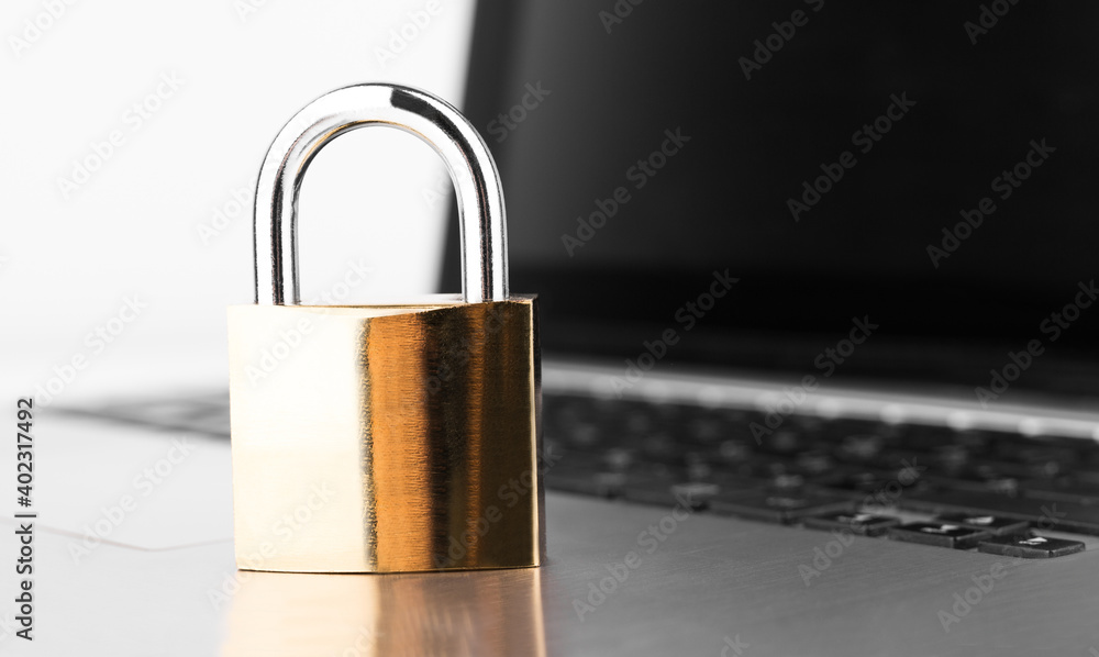 Poster cyber safety concept. lock on laptop computer keyboard.