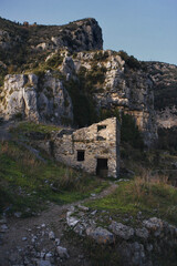 Fototapeta na wymiar Ruins of a stone house at susnet, along the spectacular the path of the gods (Sentiero Degli Dei), southern Italy ,Campania region.