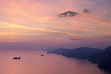 Obraz premium Panorama view of Mediterranean Sea at famous Amalfi Coast in beautiful pink evening light at sunset. Campania, Italy.