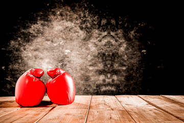 Boxing gloves on a wooden table before the fight of old