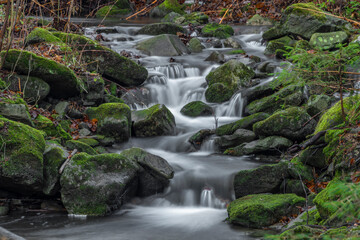Fototapeta na wymiar Waterfall on Bucaci creek in Moravskoslezske Beskydy mountains in winter day