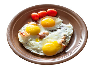 three fried eggs with bacon on brown ceramic plate cut out on white background