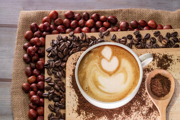 hot cappuccino cup and coffee beans