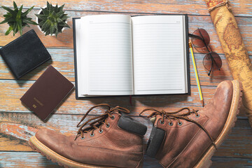 Travel journal with map and travel shoes