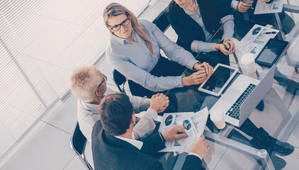 top view. business colleagues discussing business documents.
